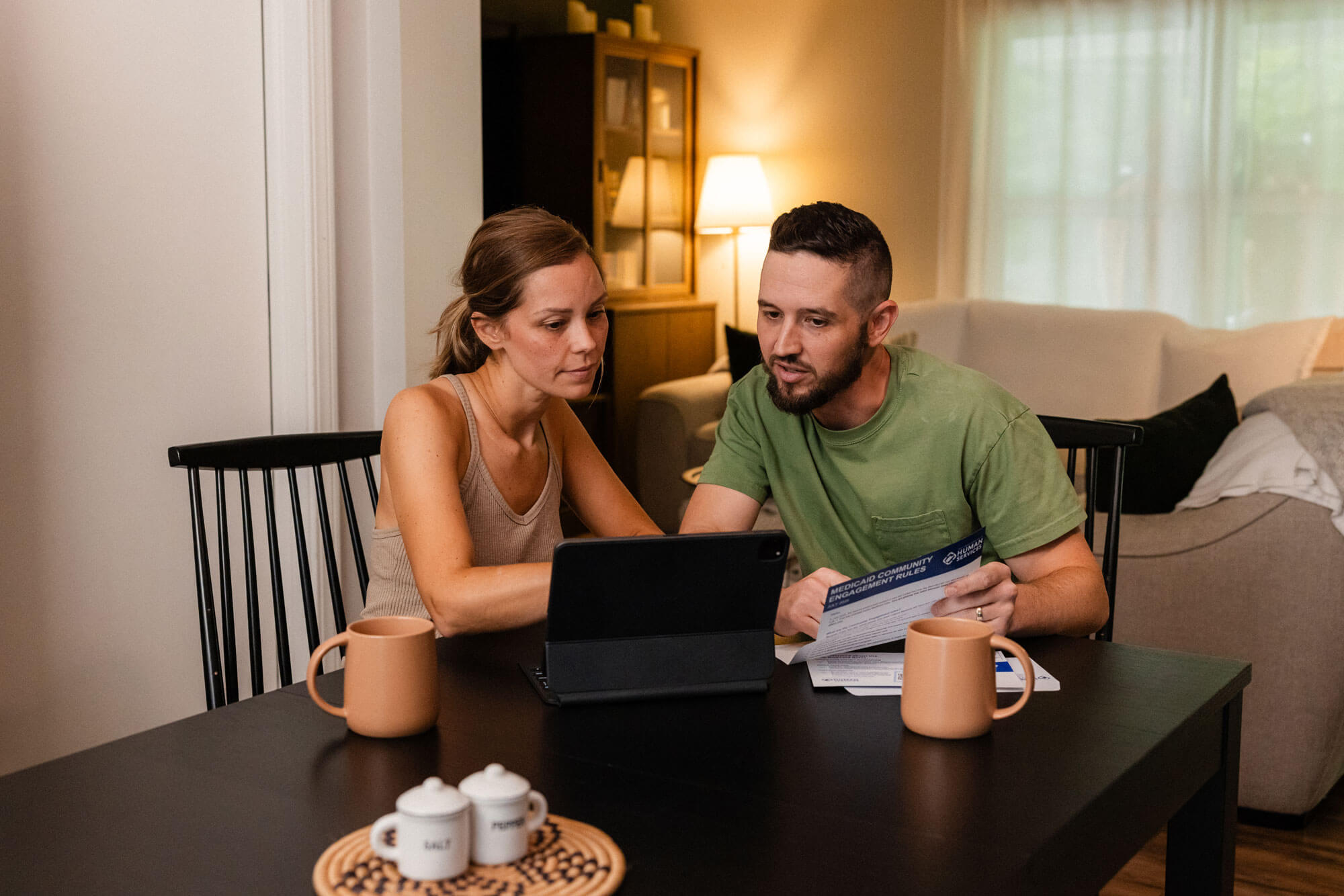 Couple discussing coverage at the kitchen table.